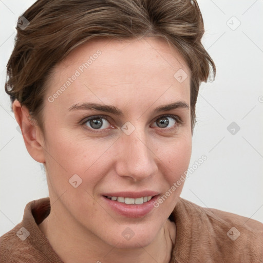 Joyful white young-adult female with short  brown hair and blue eyes