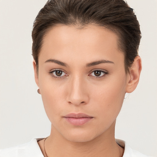 Neutral white young-adult female with short  brown hair and brown eyes