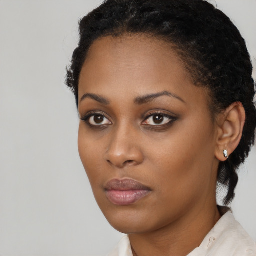 Neutral black young-adult female with short  black hair and brown eyes