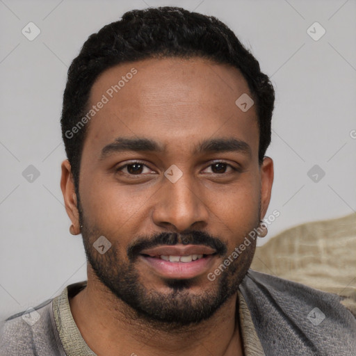 Joyful black young-adult male with short  black hair and brown eyes