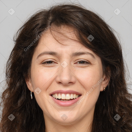 Joyful white adult female with long  brown hair and brown eyes