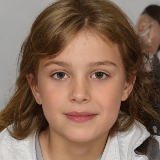 Joyful white child female with medium  brown hair and brown eyes