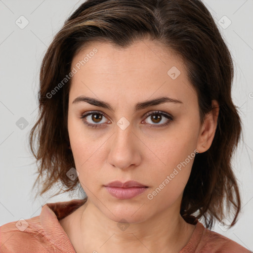 Neutral white young-adult female with medium  brown hair and brown eyes