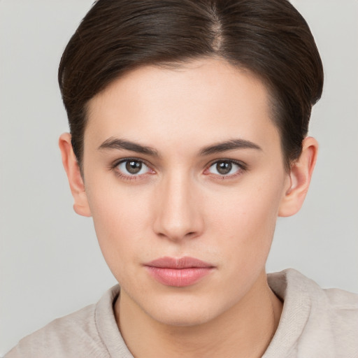 Neutral white young-adult female with short  brown hair and brown eyes