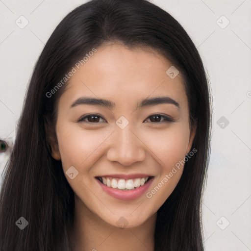 Joyful asian young-adult female with long  brown hair and brown eyes