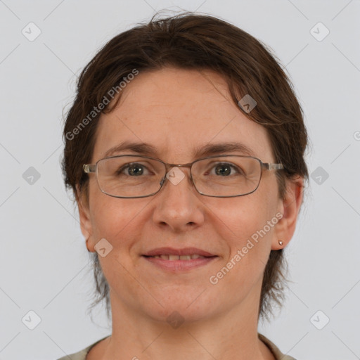 Joyful white adult female with medium  brown hair and grey eyes