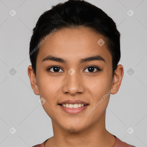 Joyful latino young-adult female with short  black hair and brown eyes