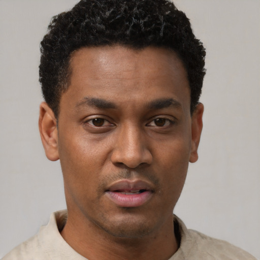 Neutral latino young-adult male with short  brown hair and brown eyes