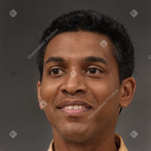 Joyful black young-adult male with short  brown hair and brown eyes
