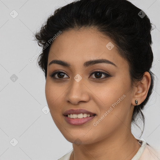 Joyful latino young-adult female with long  brown hair and brown eyes