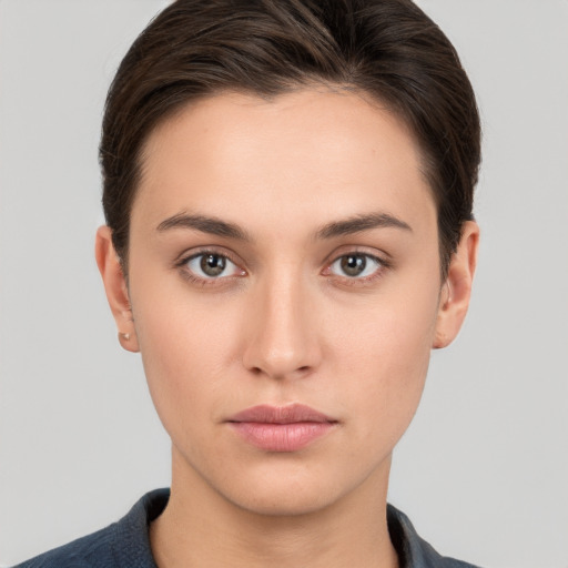 Neutral white young-adult female with short  brown hair and brown eyes