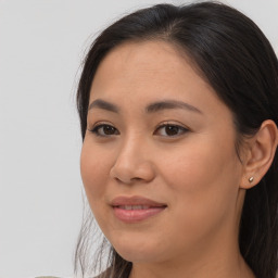 Joyful asian young-adult female with long  brown hair and brown eyes