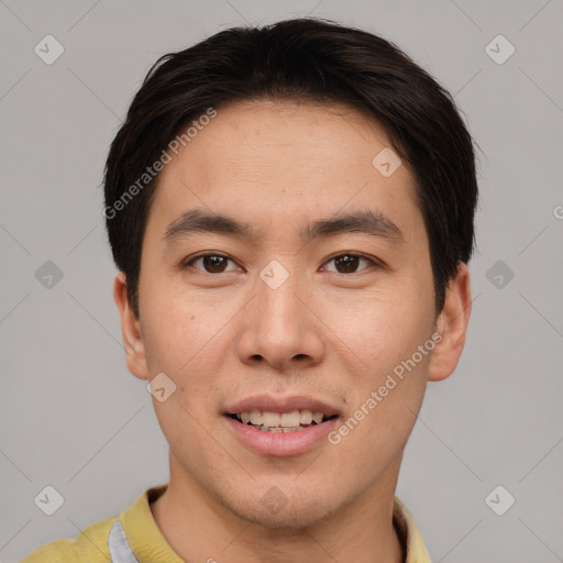 Joyful asian young-adult male with short  brown hair and brown eyes