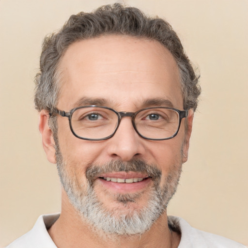 Joyful white adult male with short  gray hair and brown eyes