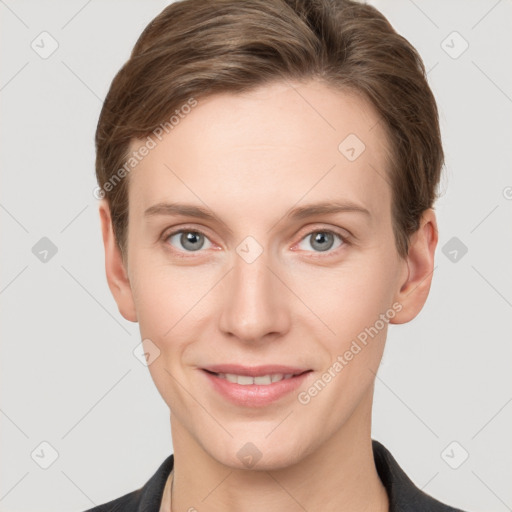 Joyful white young-adult female with short  brown hair and grey eyes