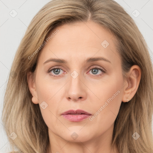 Joyful white adult female with long  brown hair and grey eyes