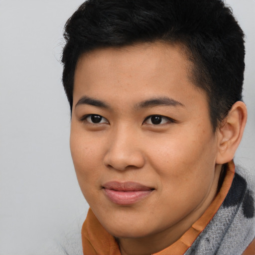 Joyful asian young-adult female with short  brown hair and brown eyes