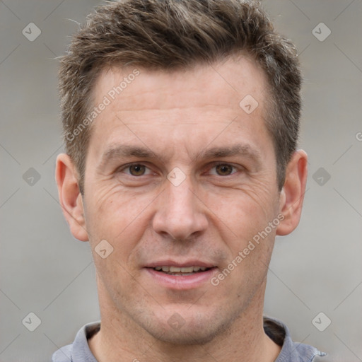 Joyful white adult male with short  brown hair and grey eyes