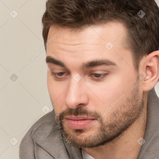 Neutral white young-adult male with short  brown hair and brown eyes