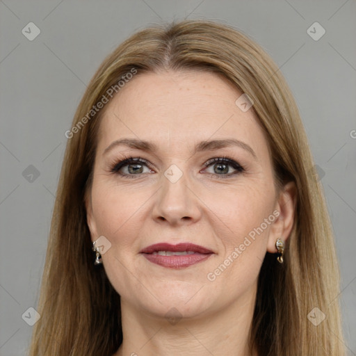 Joyful white adult female with long  brown hair and grey eyes