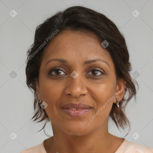 Joyful black adult female with medium  brown hair and brown eyes