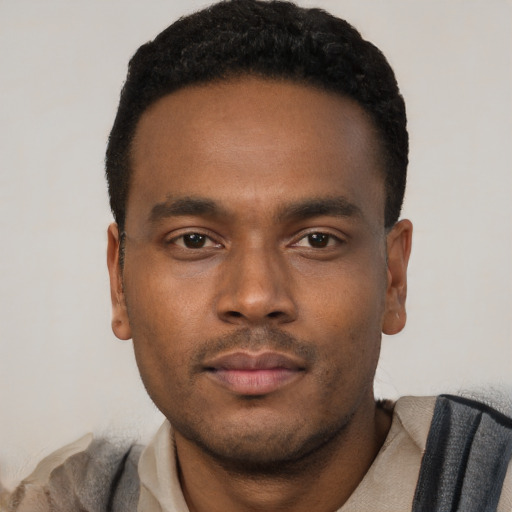 Neutral black young-adult male with short  black hair and brown eyes