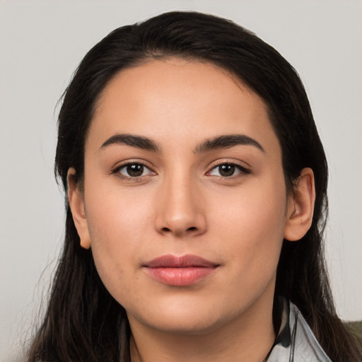 Joyful white young-adult female with long  black hair and brown eyes