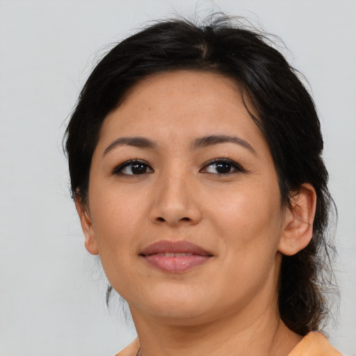 Joyful asian young-adult female with medium  brown hair and brown eyes