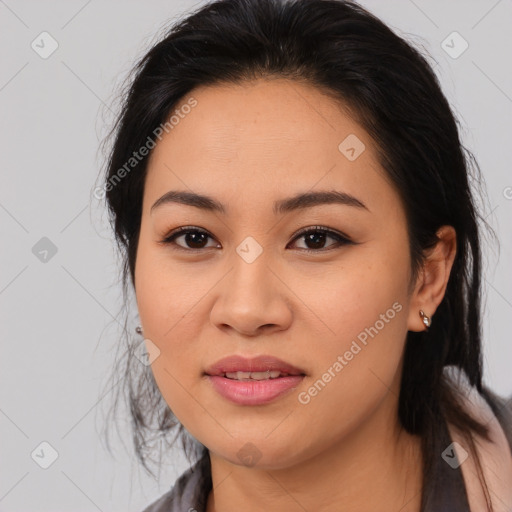 Joyful asian young-adult female with long  brown hair and brown eyes