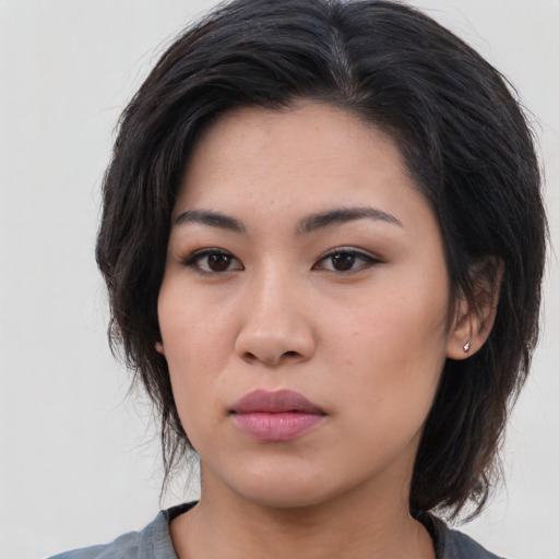 Neutral asian young-adult female with medium  brown hair and brown eyes