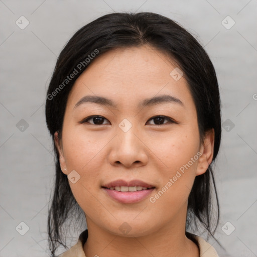 Joyful asian young-adult female with medium  black hair and brown eyes