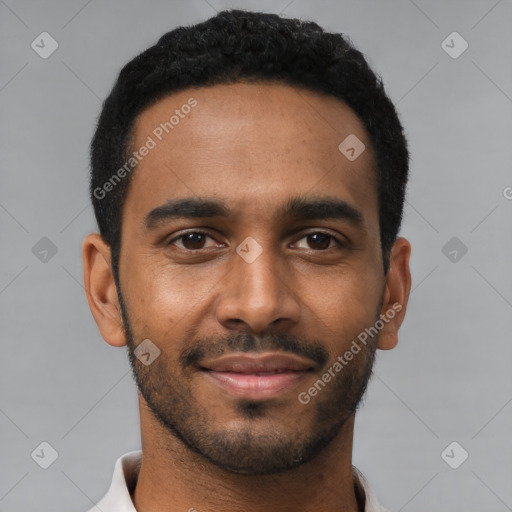 Joyful black young-adult male with short  black hair and brown eyes