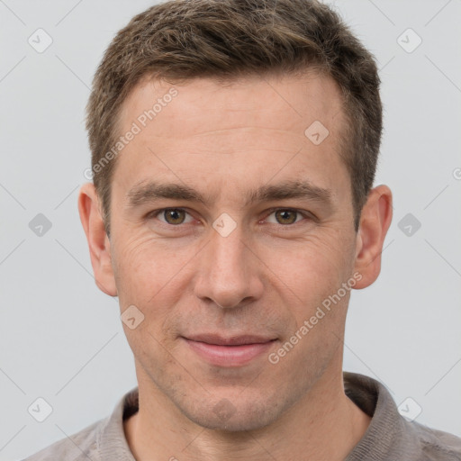 Joyful white adult male with short  brown hair and grey eyes