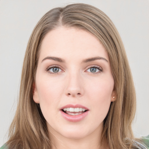 Joyful white young-adult female with medium  brown hair and green eyes