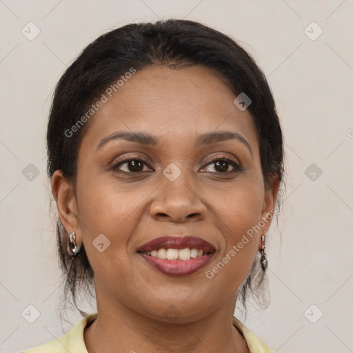 Joyful latino adult female with medium  brown hair and brown eyes