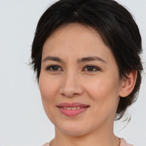 Joyful white young-adult female with medium  brown hair and brown eyes