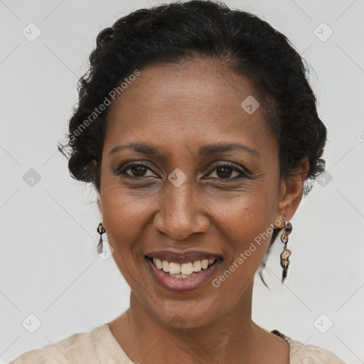 Joyful black adult female with short  brown hair and brown eyes