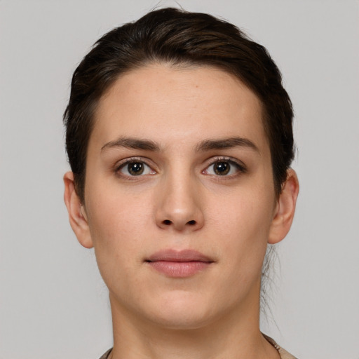 Neutral white young-adult female with short  brown hair and brown eyes