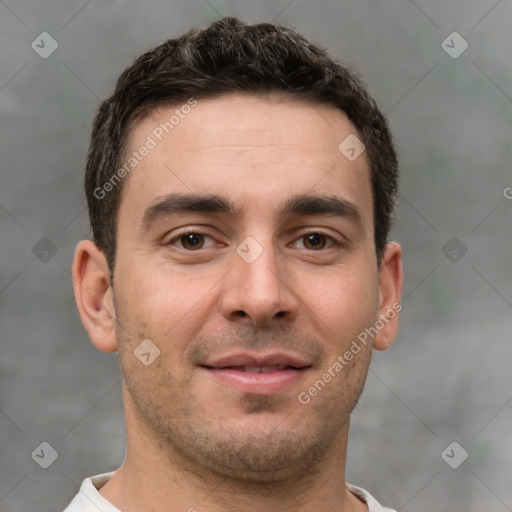 Joyful white young-adult male with short  brown hair and brown eyes