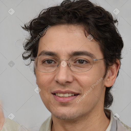 Joyful white adult male with medium  brown hair and brown eyes