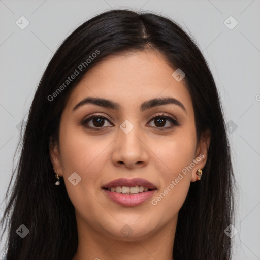 Joyful latino young-adult female with long  brown hair and brown eyes