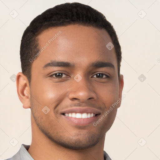 Joyful black young-adult male with short  brown hair and brown eyes