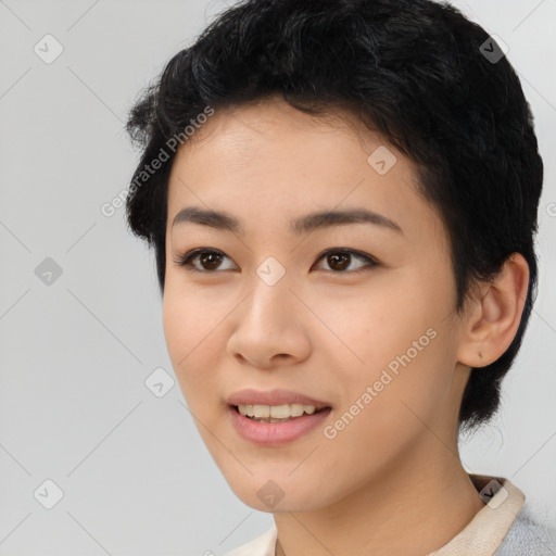 Joyful asian young-adult female with short  black hair and brown eyes