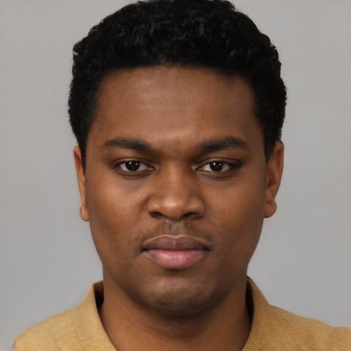 Neutral black young-adult male with short  black hair and brown eyes