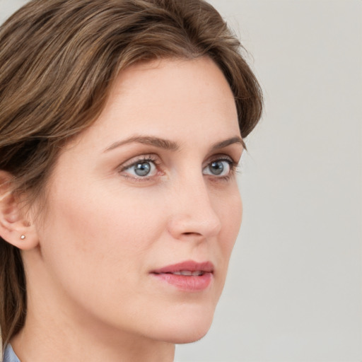 Neutral white young-adult female with medium  brown hair and grey eyes