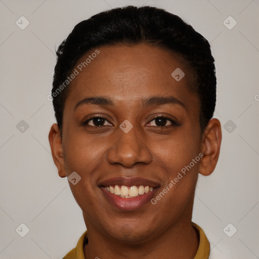 Joyful black young-adult female with short  brown hair and brown eyes