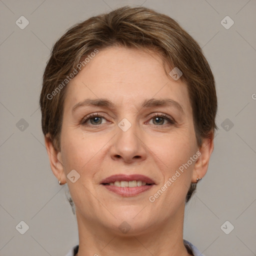 Joyful white adult female with short  brown hair and grey eyes