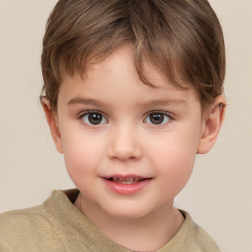 Joyful white child male with short  brown hair and brown eyes