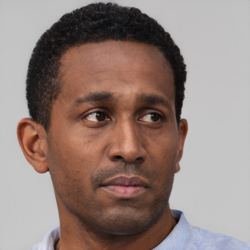 Neutral black young-adult male with short  black hair and brown eyes