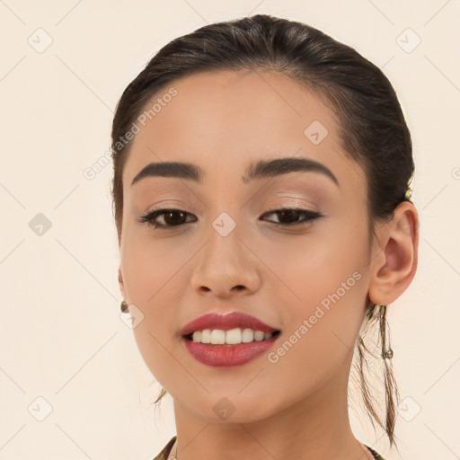 Joyful white young-adult female with long  brown hair and brown eyes